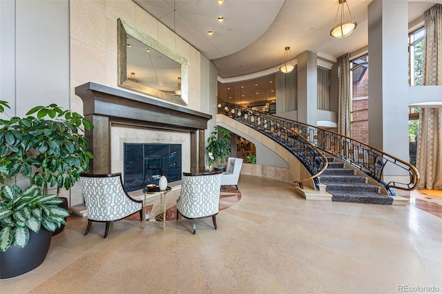 2400 E Cherry Creek S Drive 307, Denver, CO 80209 - foyer with a towering ceiling, stairs, and a high end fireplace