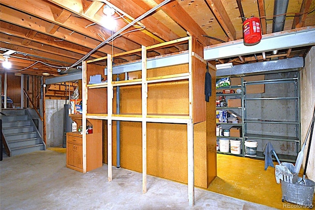 unfinished below grade area featuring stairway