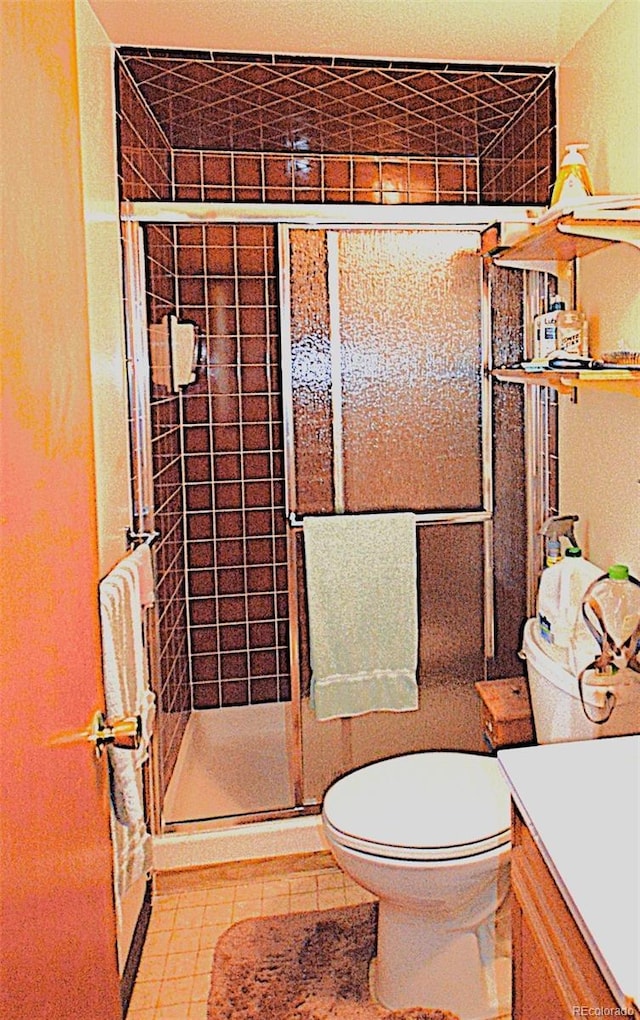 11823 Williams Way, Northglenn, CO 80233 - bathroom with toilet, a shower stall, and vanity