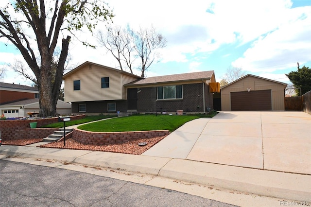 11823 Williams Way, Northglenn, CO 80233 - split level home with a garage, an outdoor structure, and brick siding