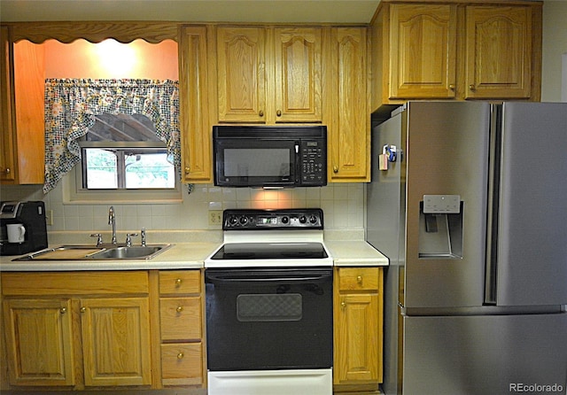 11823 Williams Way, Northglenn, CO 80233 - kitchen featuring stainless steel fridge, black microwave, range with electric cooktop, a sink, and tasteful backsplash