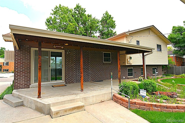11823 Williams Way, Northglenn, CO 80233 - back of property with brick siding and a patio