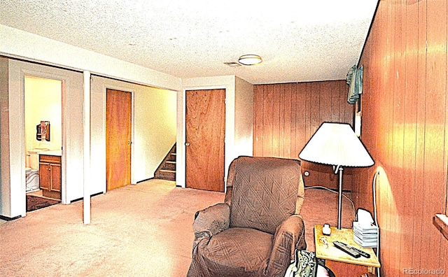 11823 Williams Way, Northglenn, CO 80233 - living area featuring carpet flooring, stairs, and wood walls