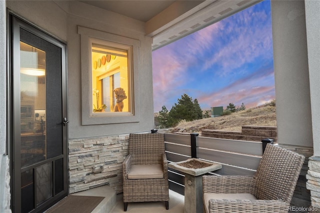 view of balcony at dusk