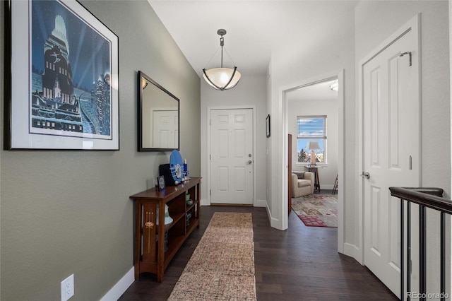 entryway with dark hardwood / wood-style floors