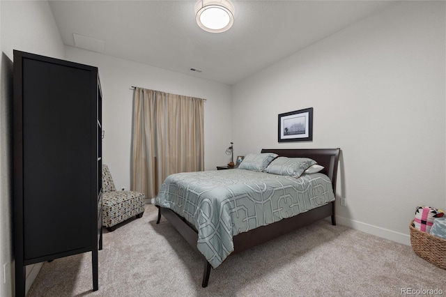 bedroom featuring light colored carpet