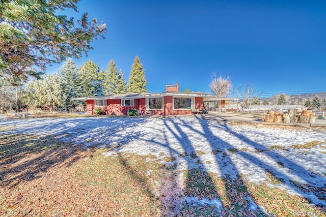 single story home with a carport