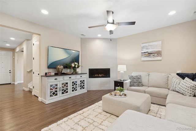 16400 Alberta Dr, Parker, CO 80134 - living room featuring wood finished floors, ceiling fan, a tile fireplace, recessed lighting, and baseboards