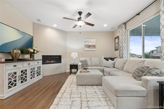 16400 Alberta Dr, Parker, CO 80134 - living area with wood finished floors, a fireplace, a ceiling fan, recessed lighting, and baseboards