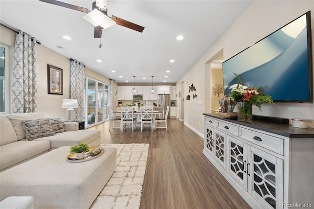 16400 Alberta Dr, Parker, CO 80134 - living area featuring a ceiling fan, dark wood-style flooring, baseboards, and recessed lighting