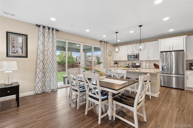 16400 Alberta Dr, Parker, CO 80134 - dining space with recessed lighting, dark wood-type flooring, and baseboards