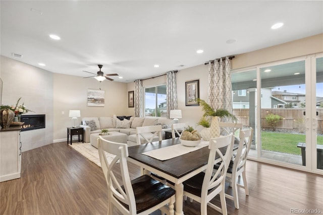16400 Alberta Dr, Parker, CO 80134 - dining area featuring wood finished floors, ceiling fan, recessed lighting, a tile fireplace, and baseboards