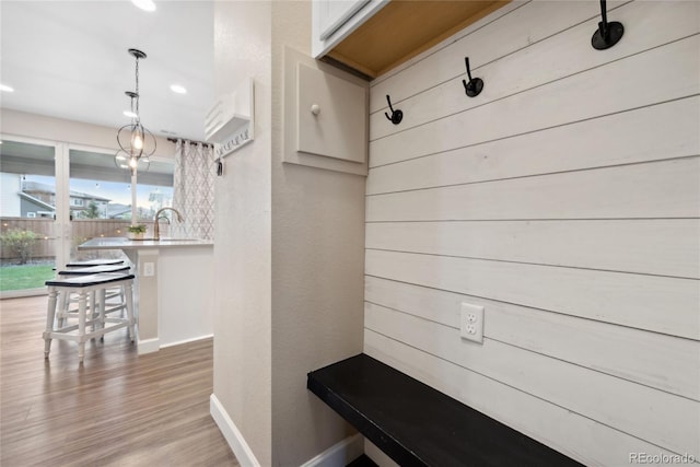 16400 Alberta Dr, Parker, CO 80134 - mudroom featuring baseboards, light wood-style flooring, a textured wall, and recessed lighting