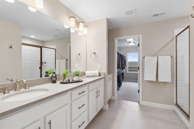 16400 Alberta Dr, Parker, CO 80134 - full bathroom with a shower stall, double vanity, baseboards, and a walk in closet