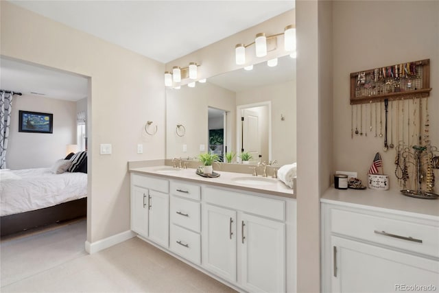 16400 Alberta Dr, Parker, CO 80134 - ensuite bathroom featuring double vanity and baseboards