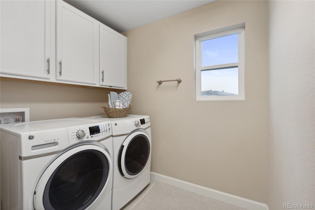 16400 Alberta Dr, Parker, CO 80134 - washroom featuring washing machine and dryer, cabinet space, and baseboards