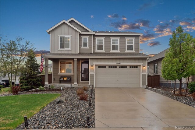 16400 Alberta Dr, Parker, CO 80134 - craftsman inspired home with covered porch, board and batten siding, a garage, driveway, and a yard
