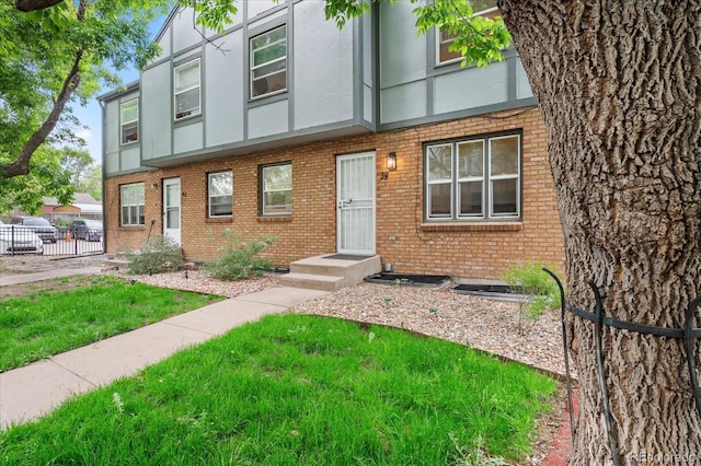 670 Winona Ct Unit 38, Denver, CO 80204 - view of front facade featuring brick siding and stucco siding