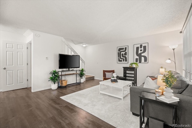 670 Winona Ct Unit 38, Denver, CO 80204 - living room with wood finished floors, baseboards, and a textured ceiling