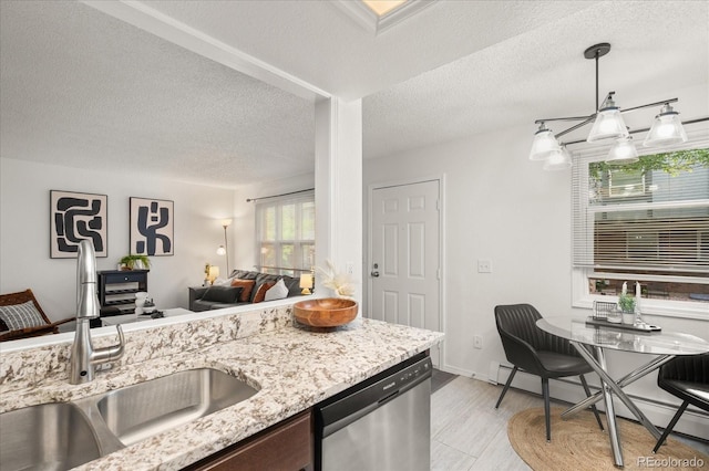 670 Winona Ct Unit 38, Denver, CO 80204 - kitchen featuring stainless steel dishwasher, a sink, open floor plan, baseboard heating, and light stone counters