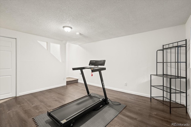 670 Winona Ct Unit 38, Denver, CO 80204 - workout room featuring wood finished floors, a textured ceiling, and baseboards