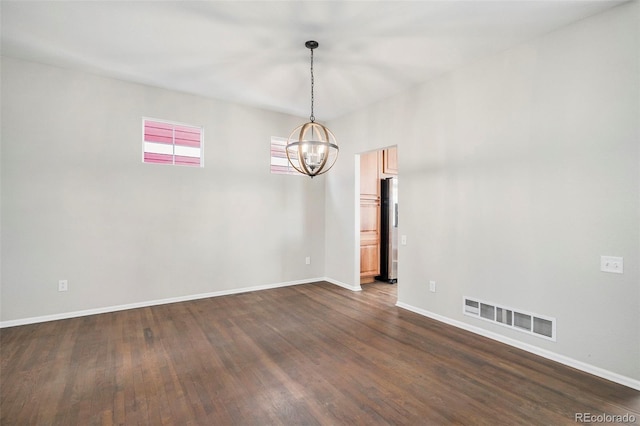 11748 Mill Valley St, Parker, CO 80138 - unfurnished room with a chandelier, dark wood-type flooring, and baseboards
