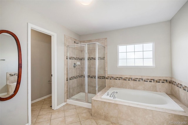 11748 Mill Valley St, Parker, CO 80138 - bathroom with a garden tub, a shower stall, tile patterned floors, and baseboards