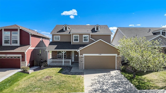 11748 Mill Valley St, Parker, CO 80138 - craftsman-style home with covered porch, stone siding, concrete driveway, a front yard, and a shingled roof