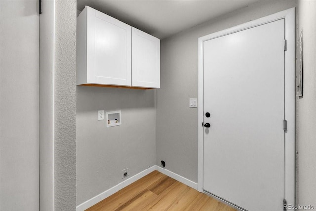 10 Juneau Pl, Longmont, CO 80504 - washroom with light wood-type flooring, cabinet space, and hookup for a washing machine