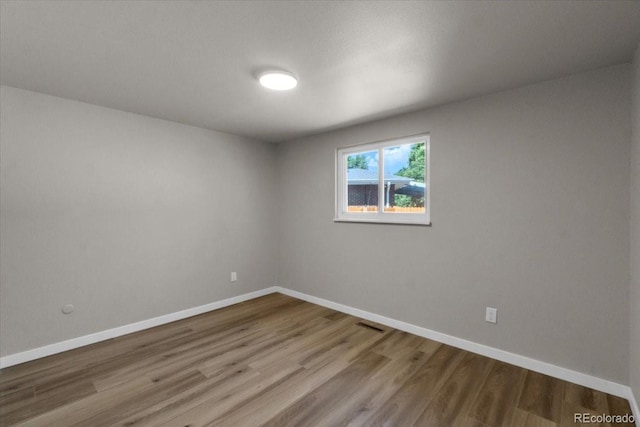 10 Juneau Pl, Longmont, CO 80504 - spare room with wood finished floors and baseboards