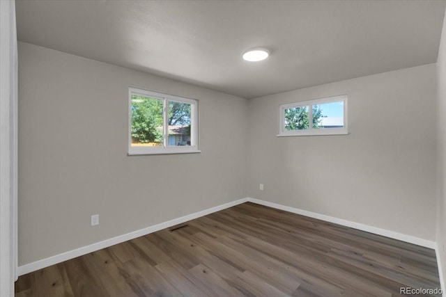10 Juneau Pl, Longmont, CO 80504 - spare room featuring plenty of natural light and dark wood-type flooring