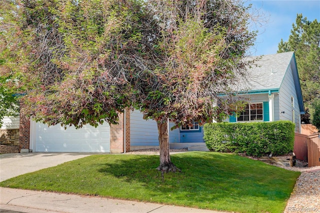 354 Willowick Cir, Highlands Ranch, CO 80129 - view of property hidden behind natural elements featuring concrete driveway, a garage, and brick siding