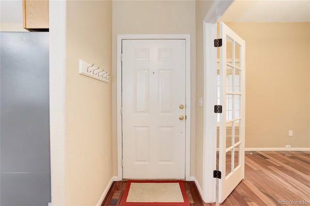 354 Willowick Cir, Highlands Ranch, CO 80129 - entryway with wood finished floors and baseboards