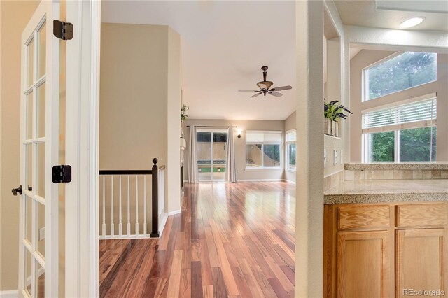 354 Willowick Cir, Highlands Ranch, CO 80129 - hall featuring wood finished floors, an upstairs landing, and baseboards