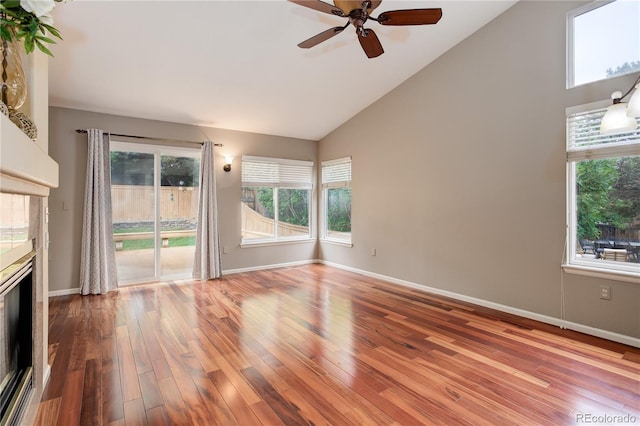 354 Willowick Cir, Highlands Ranch, CO 80129 - unfurnished living room featuring wood finished floors, ceiling fan, baseboards, and high vaulted ceiling