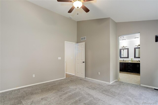 354 Willowick Cir, Highlands Ranch, CO 80129 - unfurnished bedroom with light colored carpet, baseboards, high vaulted ceiling, ensuite bathroom, and ceiling fan