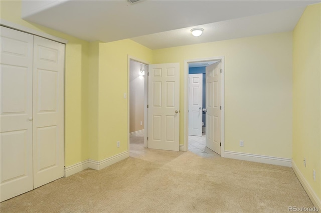354 Willowick Cir, Highlands Ranch, CO 80129 - unfurnished bedroom with light carpet, baseboards, and a closet