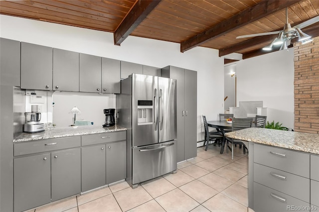 kitchen with ceiling fan, wooden ceiling, stainless steel fridge with ice dispenser, light stone counters, and beamed ceiling