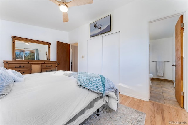 bedroom with ceiling fan and light hardwood / wood-style flooring