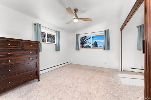 unfurnished bedroom featuring ceiling fan, baseboard heating, and light carpet