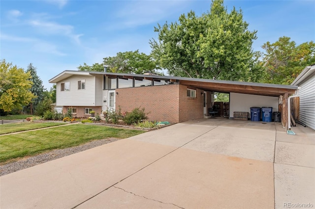 view of side of home with a lawn and a carport