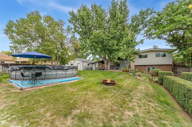 view of yard with a covered pool