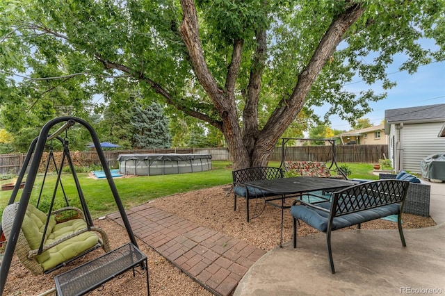 view of patio / terrace featuring a covered pool