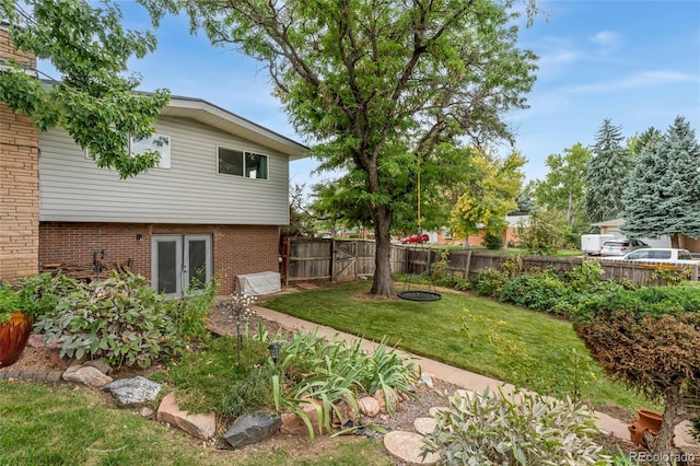 view of yard with french doors