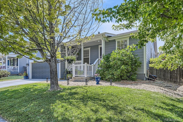 view of front of property featuring a front yard and a garage