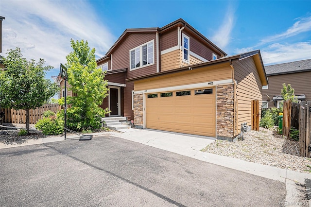 17187 E Cedar Gulch Dr, Parker, CO 80134 - view of front of home with concrete driveway, stone siding, and a garage
