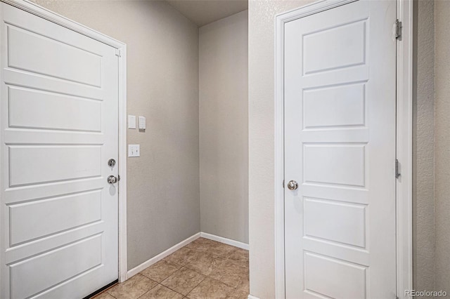17187 E Cedar Gulch Dr, Parker, CO 80134 - doorway with baseboards and light tile patterned floors