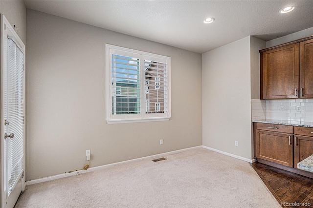 17187 E Cedar Gulch Dr, Parker, CO 80134 - unfurnished dining area with dark carpet and recessed lighting