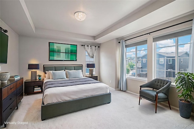 17187 E Cedar Gulch Dr, Parker, CO 80134 - bedroom with a raised ceiling, multiple windows, and light colored carpet