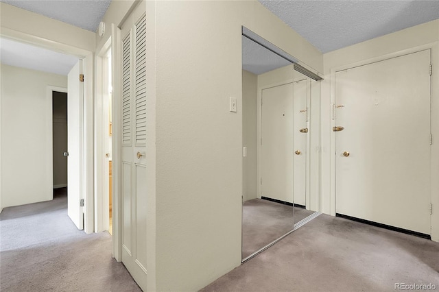 2325 S Linden Ct Unit 206, Denver, CO 80222 - corridor featuring a textured ceiling